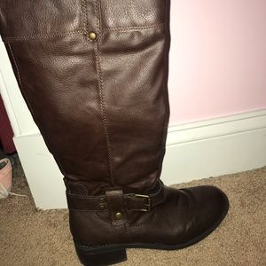 Tall brown buckle boots